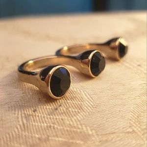 Gold/Black inverted knuckle ring hand jewelry.